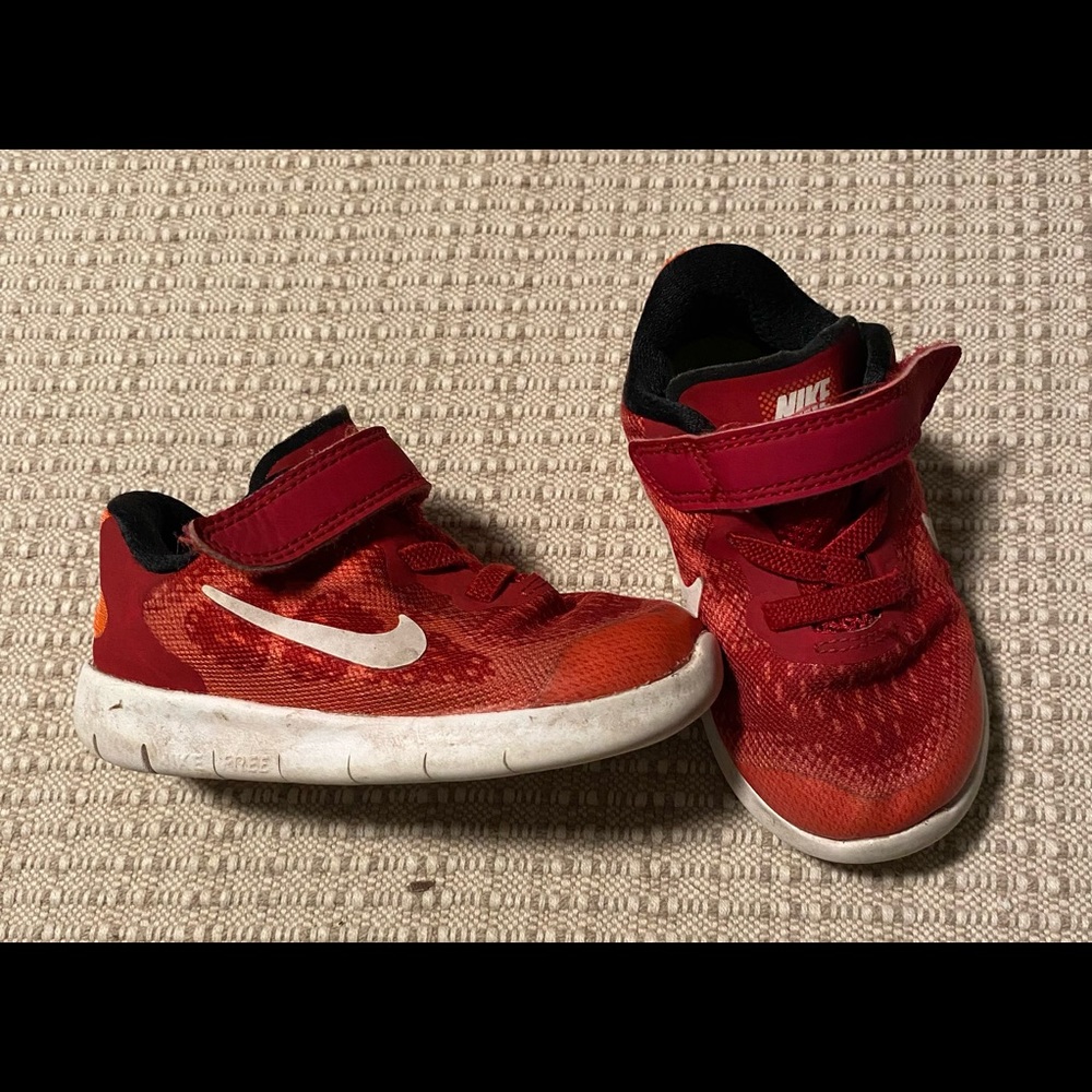 Red Nike tennis shoes
